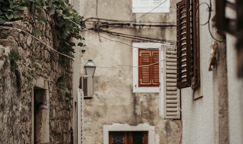 brown wooden door on gray concrete building